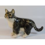 A Winstanley pottery cat, 8in high x 10.75in wide