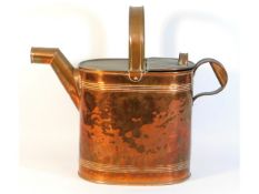 A large Christopher Dresser style copper watering