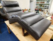 A pair of leather upholstered Le Corbusier style l