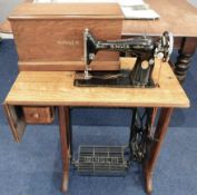 An oak Singer sewing machine table