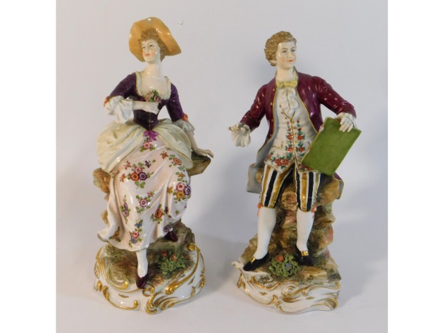 A pair of German Dresden style porcelain figures,
