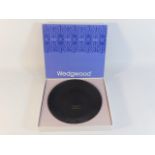 A boxed Wedgwood basalt jasperware dish with gilde