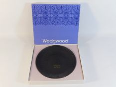 A boxed Wedgwood basalt jasperware dish with gilde