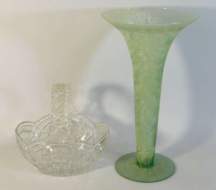 A decorative vase twinned with a cut glass basket