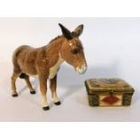 A Beswick donkey, 5.5in tall twinned with a continental porcelain box with gilding & decorative pane