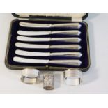 A cased set of silver handled fruit knives twinned