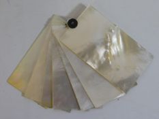 A set of mother of pearl cards, 3in high