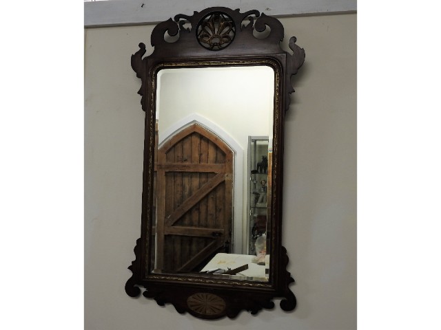 An antique Regency style mirror with bevelled glas