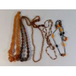 Five amber style necklaces