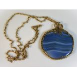 A yellow metal chain & blue agate pendant, chain 7