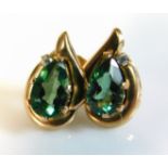 A pair of 10ct gold earrings set with green & whit