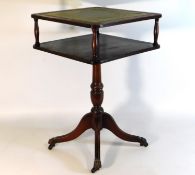 A two tier table with brass feet & leather style t