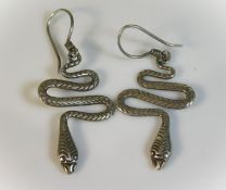 A pair of white metal snake earrings, test as silv