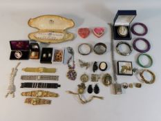 A quantity of costume jewellery including a coin b