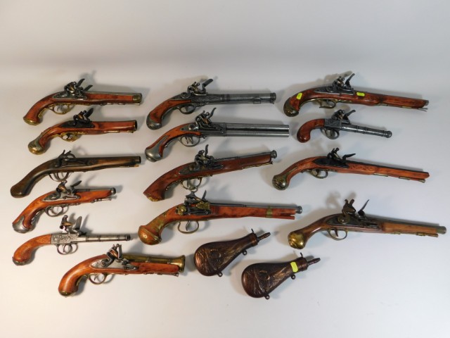 A collection of reproduction flintlocks & two powd