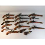 A collection of reproduction flintlocks & two powd