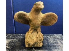 A terracotta style carved eagle, 20in high