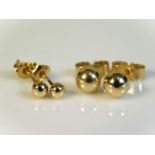 Two pairs of 9ct gold stud earrings, 0.6g