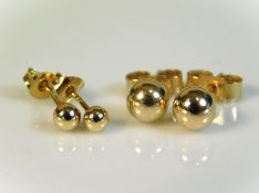 Two pairs of 9ct gold stud earrings, 0.6g