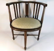 An early 20thC. corner chair twinned with a/f cane chair, 27.5in high to back