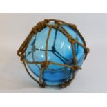 A large antique blue glass float approx. 9.5in diameter