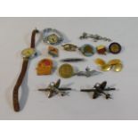 Two silver spitfire brooches, an RAF sweetheart badge, a Winnie The Pooh badge & other items