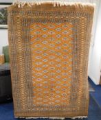 A Persian Bokhara style rug, 79in x 49in