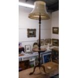 An oak standard lamp with wine table, 61in tall