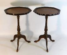 A pair of leather style topped octagonal wine tabl