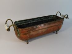 A copper trough with brass fittings & porcelain ha