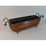 A copper trough with brass fittings & porcelain ha