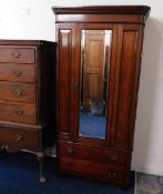 An antique mahogany wardrobe with central mirror,