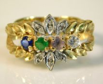 A 10ct gold ring set with four colour stones, 3.5g