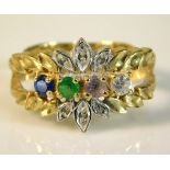 A 10ct gold ring set with four colour stones, 3.5g