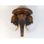 A carved wooden elephant shelf, 13.25in tall x 12i