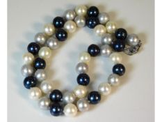 A set of three colour cultured pearls with silver