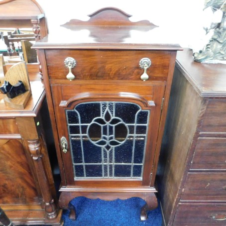 A 20thC. mahogany leaded glass cabinet with draw &