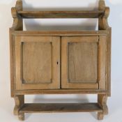 A vintage wall mounted pine cupboard, 24in high x