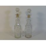A pair of 19thC. glass decanters, 13in tall