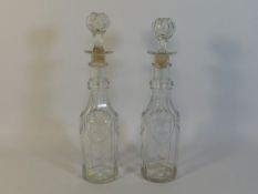 A pair of 19thC. glass decanters, 13in tall