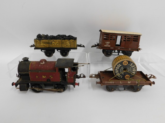 An LMS tin plate clockwork O gauge Hornby engine, Hornby tender & wagons