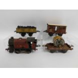 An LMS tin plate clockwork O gauge Hornby engine, Hornby tender & wagons