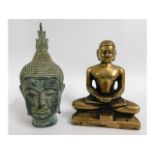 A bronze Tibetan Buddha twinned with a similar bus