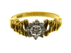 An 18ct gold diamond ring set with illusion set ce