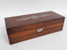 A 19thC. rosewood box with mother of pearl decorat