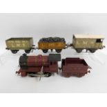 An LMS tin plate clockwork O gauge Hornby type 101 engine, tender & wagons including Meccano, Basset
