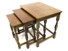 A nest of oak tables, largest 20.75in wide x 15.75