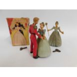 A boxed clockwork toy of dancers Cinderella & Prin