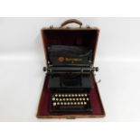 A Remington Junior typewriter with case