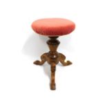 A carved revolving piano stool, 19in high